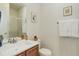 Well-lit bathroom features a vanity with white sink, framed mirror, and a glass-enclosed shower at 1176 Dales Pony Dr, Castle Rock, CO 80104