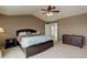 Spacious bedroom boasts a coffered ceiling, ceiling fan and stylish furnishings at 1176 Dales Pony Dr, Castle Rock, CO 80104