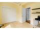 Bright, minimalist bedroom with hardwood floors, closet, and access to an ensuite bathroom at 1176 Dales Pony Dr, Castle Rock, CO 80104