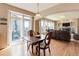 Dining area with sliding doors to the deck and access to living room, offering seamless indoor-outdoor living at 1176 Dales Pony Dr, Castle Rock, CO 80104