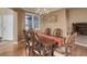 Elegant dining room with hardwood floors, chandelier, and a large window for natural light at 1176 Dales Pony Dr, Castle Rock, CO 80104
