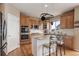 Modern kitchen featuring a center island, stainless steel appliances, and adjacent breakfast area at 1176 Dales Pony Dr, Castle Rock, CO 80104