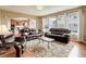 Open-concept living room offering seamless transition to the kitchen and dining areas, ideal for entertaining at 1176 Dales Pony Dr, Castle Rock, CO 80104