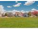 Community playground with colorful structures and green space, great for families at 1176 Dales Pony Dr, Castle Rock, CO 80104
