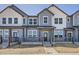 Charming townhome showcasing a modern exterior design with a welcoming front porch and ample natural light at 6562 Arbor Blvd # 4, Thornton, CO 80602