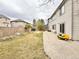 Large backyard with patio, landscaping, and mature trees at 412 E 131St Ave, Thornton, CO 80241