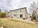Large backyard featuring mature trees and patio area, great for entertaining at 412 E 131St Ave, Thornton, CO 80241