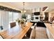 Open floor plan of dining room area leading into a living room with a fireplace at 412 E 131St Ave, Thornton, CO 80241