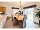 Dining area with a wood table, upholstered chairs, and sliding door to outside at 412 E 131St Ave, Thornton, CO 80241