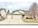 Charming two-story home with a three-car garage and well-manicured lawn at 412 E 131St Ave, Thornton, CO 80241