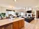 Bright, open floor plan showing the kitchen, dining area, and living room at 412 E 131St Ave, Thornton, CO 80241