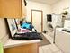Functional laundry room with modern appliances and counter space at 412 E 131St Ave, Thornton, CO 80241