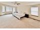 Large main bedroom features neutral carpet, big windows, and plenty of open space at 412 E 131St Ave, Thornton, CO 80241