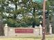 Rolling Hills at Thorncreek neighborhood entrance sign with mature trees at 412 E 131St Ave, Thornton, CO 80241