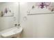 Stylish half bathroom with vessel sink and elegant wall decor at 2138 N Glenarm Pl, Denver, CO 80205