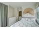 Serene bedroom with neutral tones, stylish decor, and ample natural light, creating a relaxing retreat at 2138 N Glenarm Pl, Denver, CO 80205