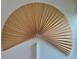 An eye catching semi circle wall hanging with a tassel at 2138 N Glenarm Pl, Denver, CO 80205