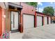 Modern garage entrance with three separate single door garages leading to the front door at 2138 N Glenarm Pl, Denver, CO 80205