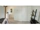 Hallway with sliding closet doors and convenient shelving at 2138 N Glenarm Pl, Denver, CO 80205