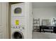 Efficient laundry area with stacked washer and dryer in unit at 2138 N Glenarm Pl, Denver, CO 80205