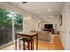Bright living room featuring hardwood floors, modern lighting, a comfortable sofa, and sliding glass doors to a patio at 2138 N Glenarm Pl, Denver, CO 80205