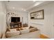 Comfortable living room with hardwood floors, stylish lighting, a comfy sofa, and decor that is both welcoming and modern at 2138 N Glenarm Pl, Denver, CO 80205
