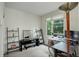 Bright home office with large window, desk, and stylish shelving at 2138 N Glenarm Pl, Denver, CO 80205
