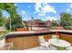 Inviting rooftop patio is furnished for relaxation and outdoor enjoyment with neighborhood views at 2138 N Glenarm Pl, Denver, CO 80205