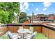 Charming rooftop patio offers an inviting outdoor space with views of the surrounding neighborhood at 2138 N Glenarm Pl, Denver, CO 80205