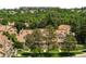 Desirable aerial view of townhomes with mature trees, green lawns, and nearby foliage at 7373 E Iowa Ave # 1124, Denver, CO 80231