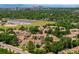 Stunning aerial view of townhomes and a solar array with the Denver skyline in the distance at 7373 E Iowa Ave # 1124, Denver, CO 80231
