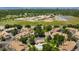 Impressive aerial view of community amenities including a park, tennis court, school, and solar array at 7373 E Iowa Ave # 1124, Denver, CO 80231