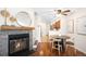 Open-concept dining area with hardwood floors and stylish light fixture, seamlessly connects to kitchen at 7373 E Iowa Ave # 1124, Denver, CO 80231