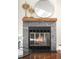 Close-up of a stunning fireplace with decorative tile surround and elegant mantle at 7373 E Iowa Ave # 1124, Denver, CO 80231
