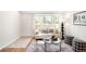 Bright living room boasts ample natural light, modern furnishings, and a stylish decorative rug at 7373 E Iowa Ave # 1124, Denver, CO 80231