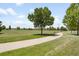 Peaceful view of a park with walking paths and mature trees at 7373 E Iowa Ave # 1124, Denver, CO 80231