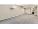 Finished basement featuring neutral walls, plush carpeting, double doors, and natural light at 11302 Tumbleweed Way, Parker, CO 80138