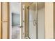 Modern bathroom featuring a glass-enclosed shower and access to the main bedroom at 11302 Tumbleweed Way, Parker, CO 80138