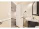 Powder room featuring a modern sink vanity, updated faucet, and attractive mirror at 11302 Tumbleweed Way, Parker, CO 80138