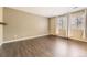 Cozy bedroom featuring hardwood floors, ample natural light, and neutral wall color at 11302 Tumbleweed Way, Parker, CO 80138