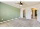 Bedroom featuring plush carpet, ceiling fan, and a closet for plenty of storage at 11302 Tumbleweed Way, Parker, CO 80138