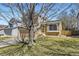 Two-story home with a charming exterior, featuring a well-maintained lawn at 11302 Tumbleweed Way, Parker, CO 80138