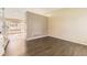 Inviting living room with dark wood floors and neutral walls at 11302 Tumbleweed Way, Parker, CO 80138