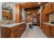 Large bathroom features wood paneling, double sinks, soaking tub and plentiful storage space at 239 Aspen Pl, Evergreen, CO 80439