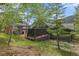 Backyard featuring a gazebo, hot tub, and wooden deck, backing to trees at 239 Aspen Pl, Evergreen, CO 80439