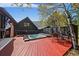Hot tub and seating area on a deck, offering a relaxing view of the surrounding landscape and modern home at 239 Aspen Pl, Evergreen, CO 80439