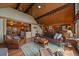 Relaxing living room with vaulted wood ceilings and exposed beams, with comfortable furniture and a cozy atmosphere at 239 Aspen Pl, Evergreen, CO 80439