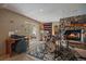 Inviting music room with a drum set and a stone fireplace, creating a cozy ambiance at 239 Aspen Pl, Evergreen, CO 80439