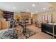 Inviting music room featuring a stone fireplace, natural light, and a comfortable ambiance at 239 Aspen Pl, Evergreen, CO 80439