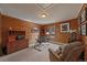 Home office with wood paneled walls, desk, comfortable seating and plenty of natural light at 239 Aspen Pl, Evergreen, CO 80439